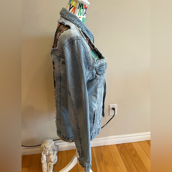 Revamped distressed look jean jacket. Floral lace inert details. - Picture 2 of 5